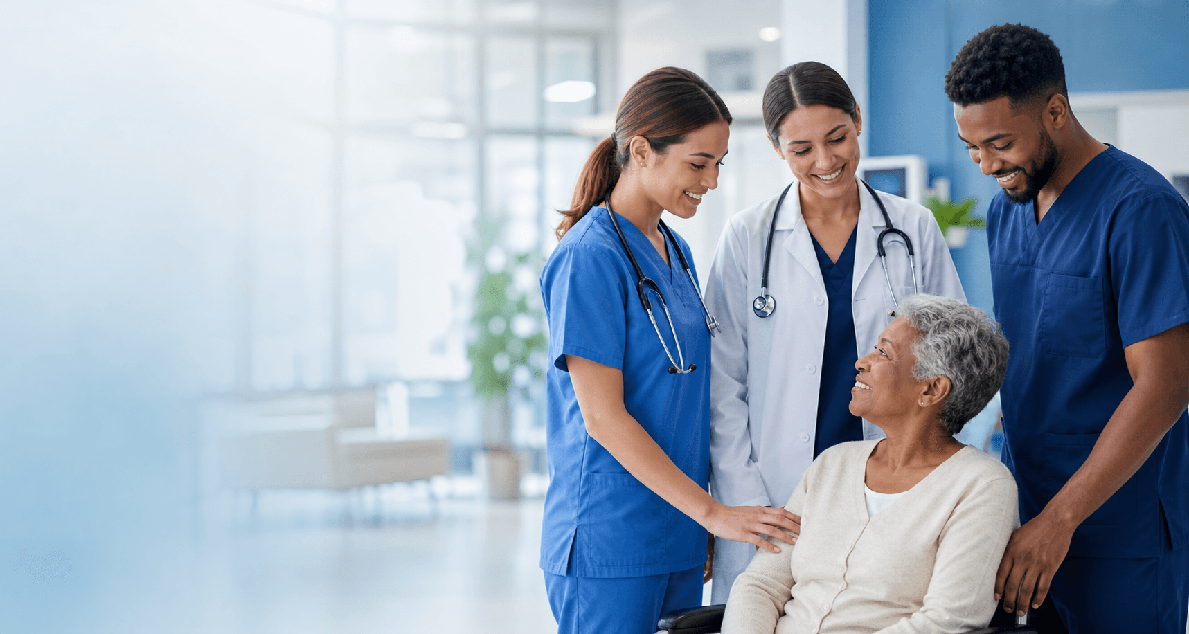Healthcare professionals supporting an older patient in a clinical setting